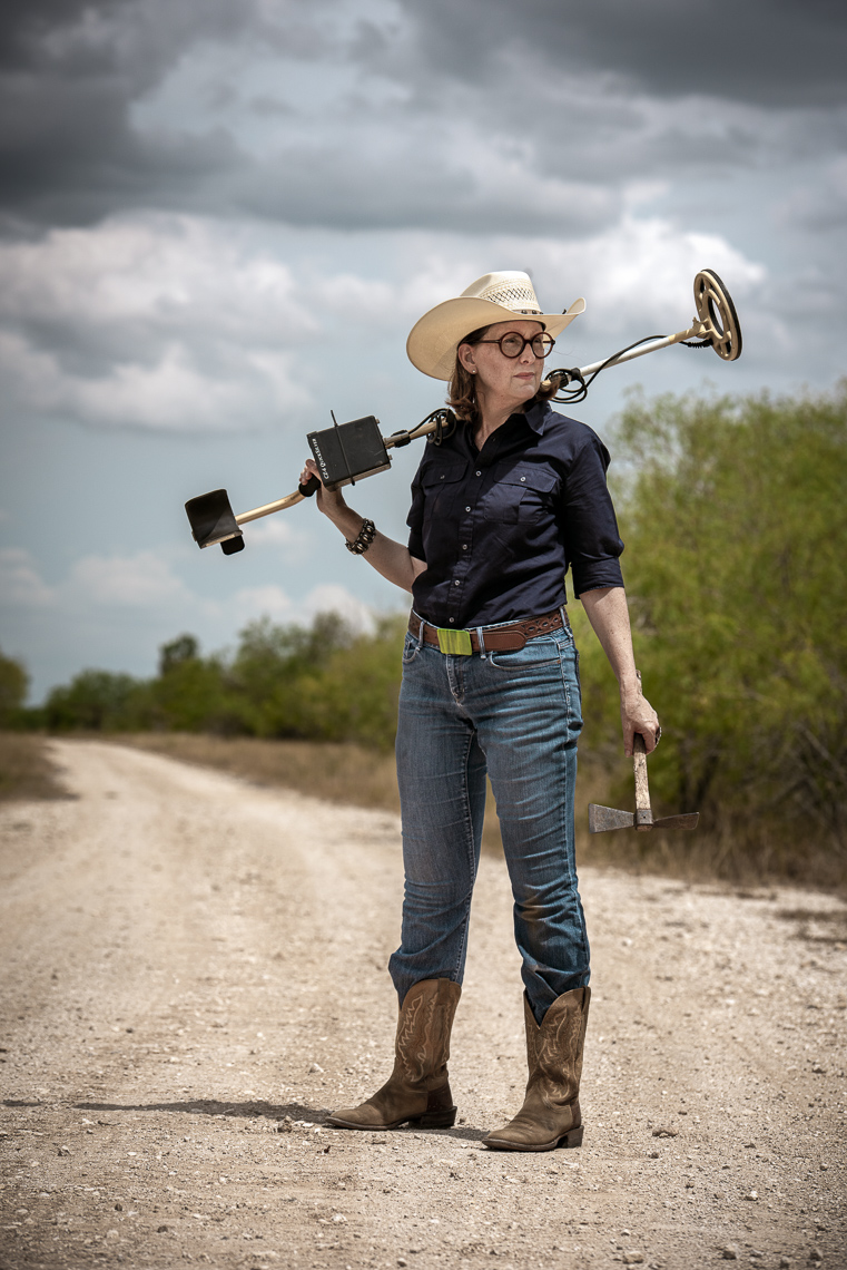 Woman-in-cowboy-hat-holding-a-metal-detector-Texas