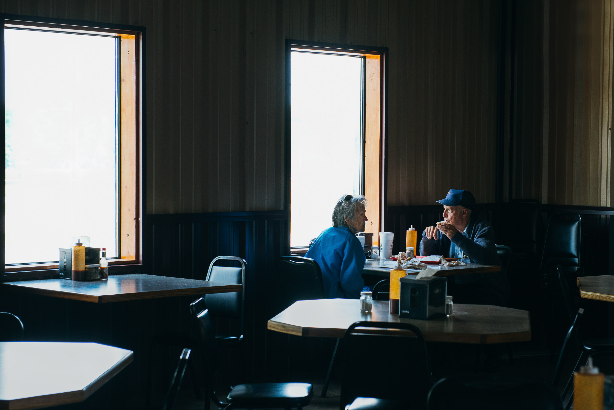 Cinematic image of a lone couple dining  at Baker-Boys-BBQ-Gonzales-Texas.