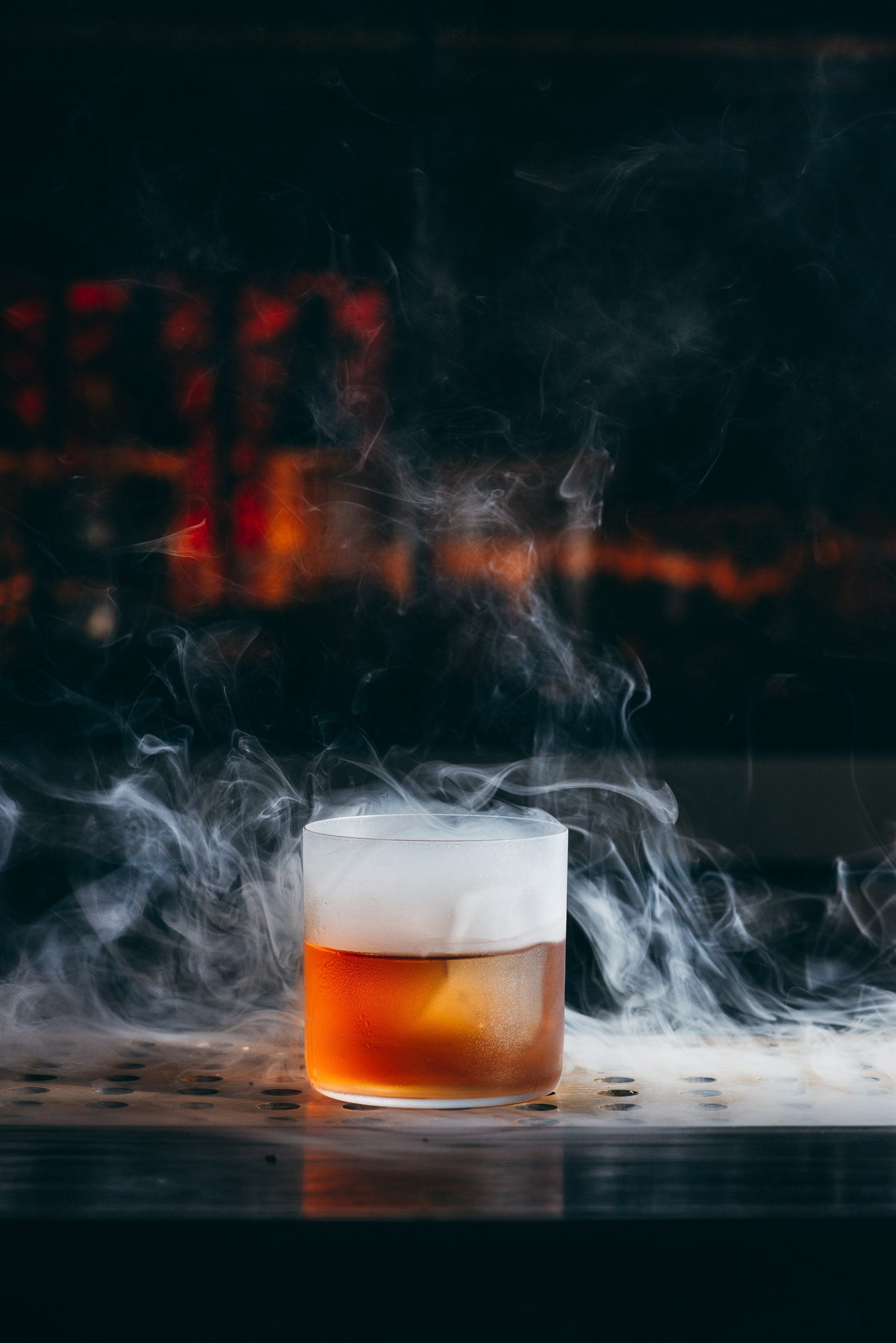 Smoking cocktail at-Here-Nor-There speakeasy in Austin-TX