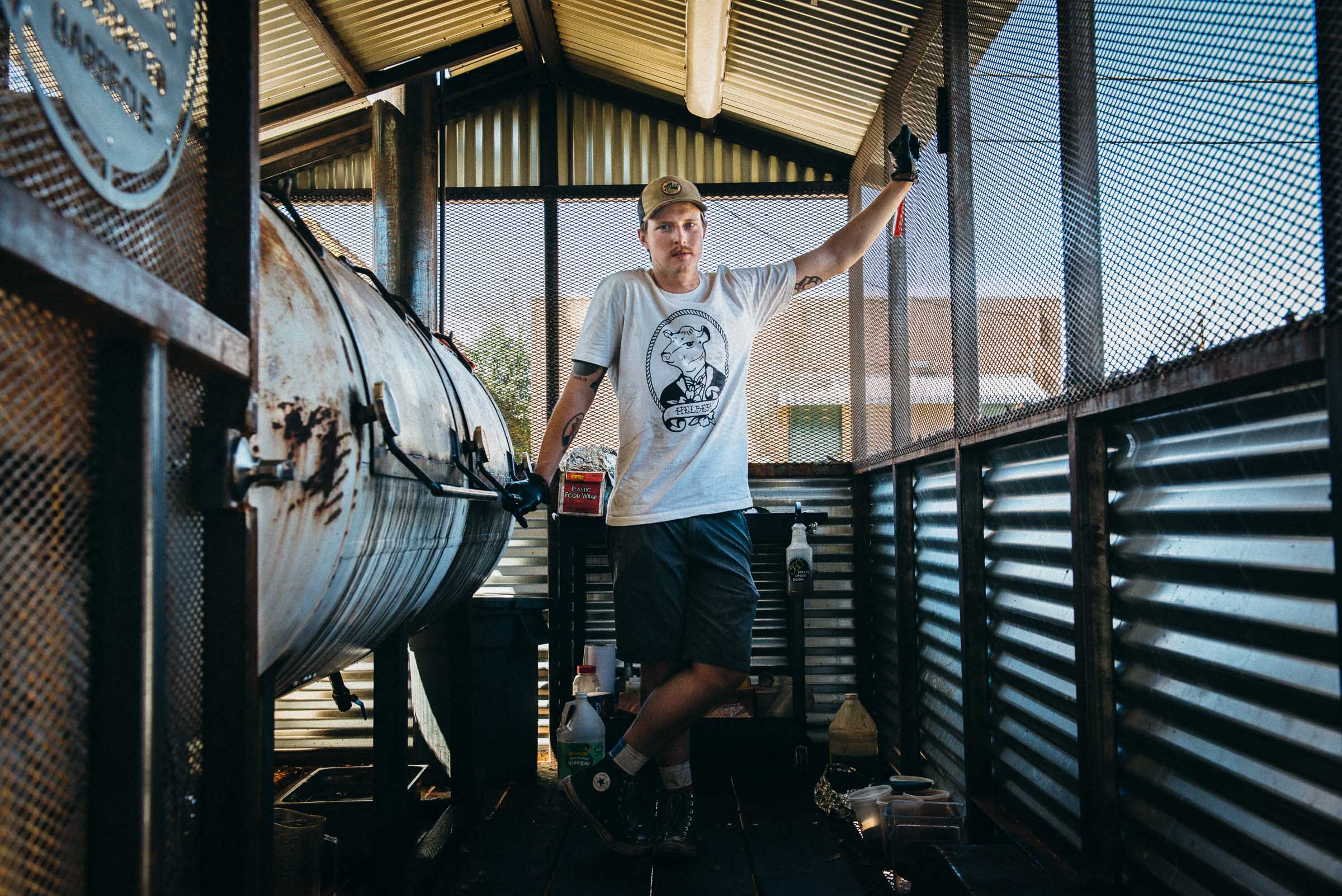 Portrait - Pitmaster Phillip Helberg in his BBQ smoker - Waco-TX