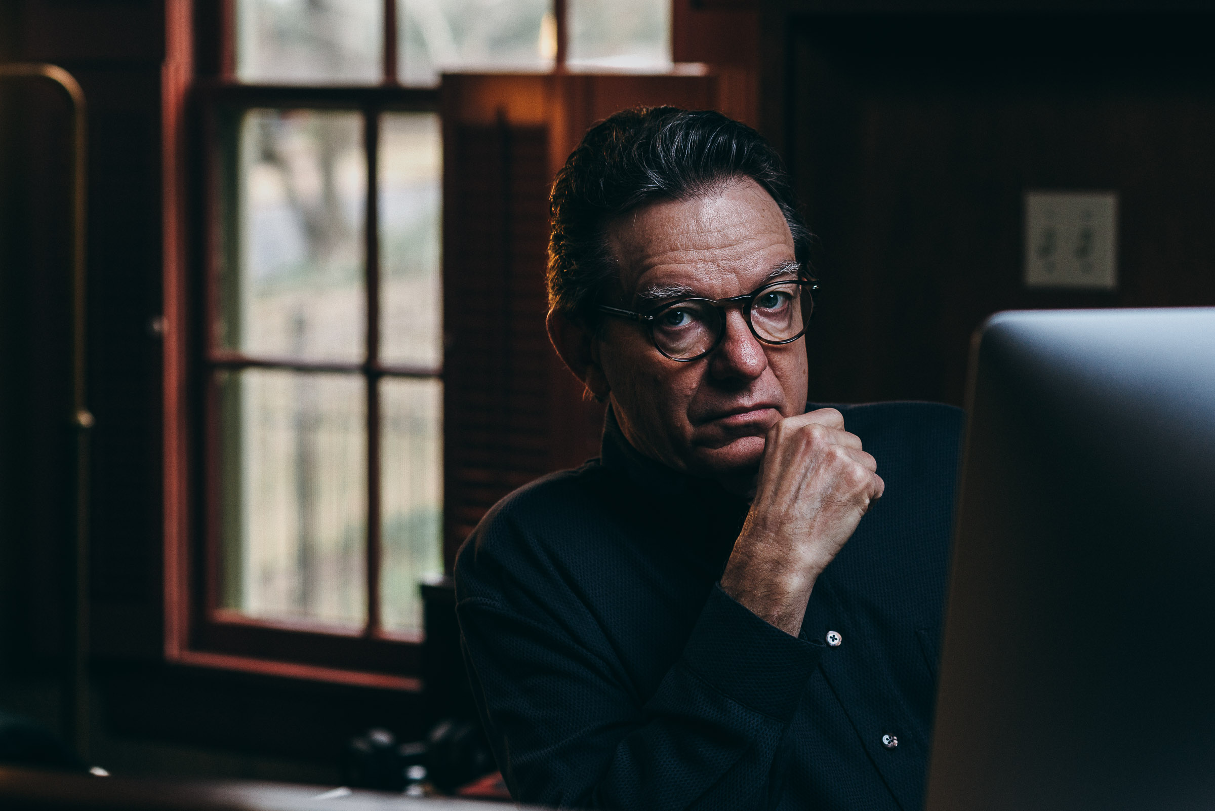 Editorial portrait - Lawrence Wright - author at his desk
