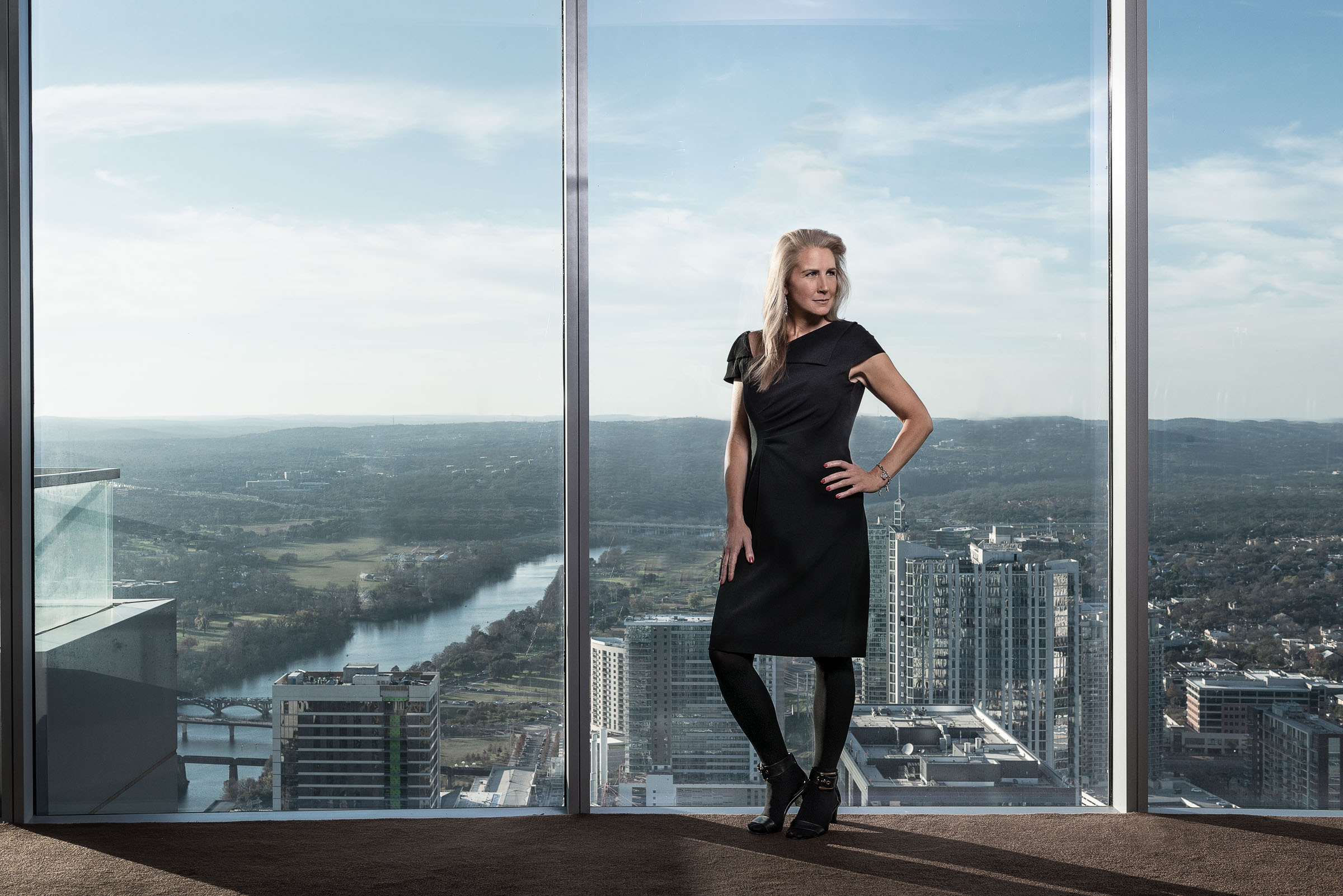 Executive portrait Austin, TX - Michelle Skelding before panoramic 54th floor views.