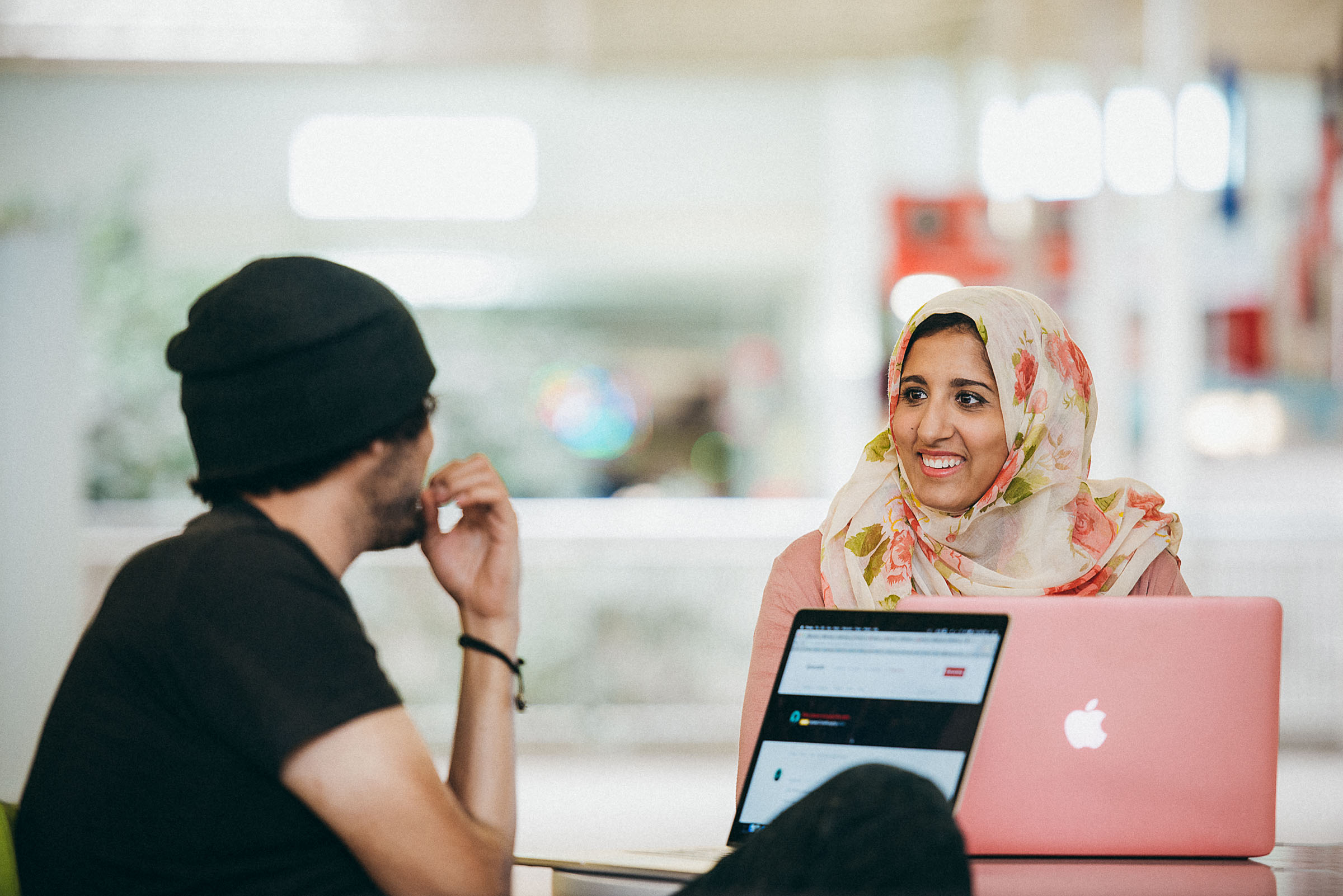 Diversity in tech/lifestyle photography - two colleagues chat at Rackspace San Antonio.